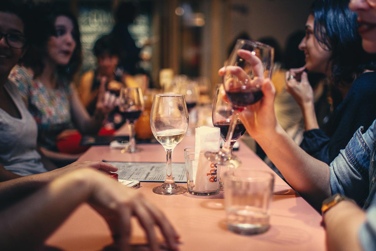 Friends drinking wine in bar