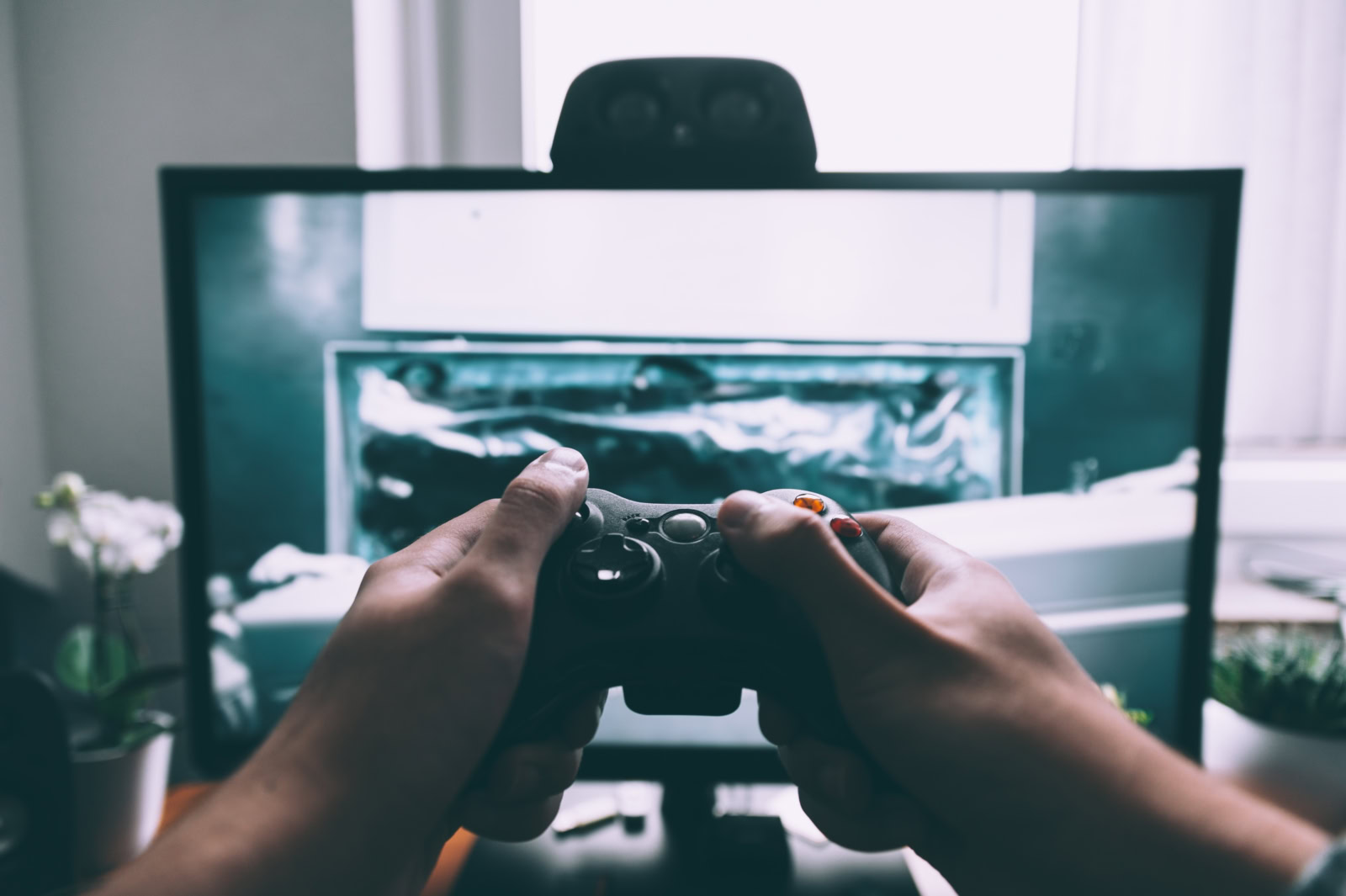 close up of hands playing video games