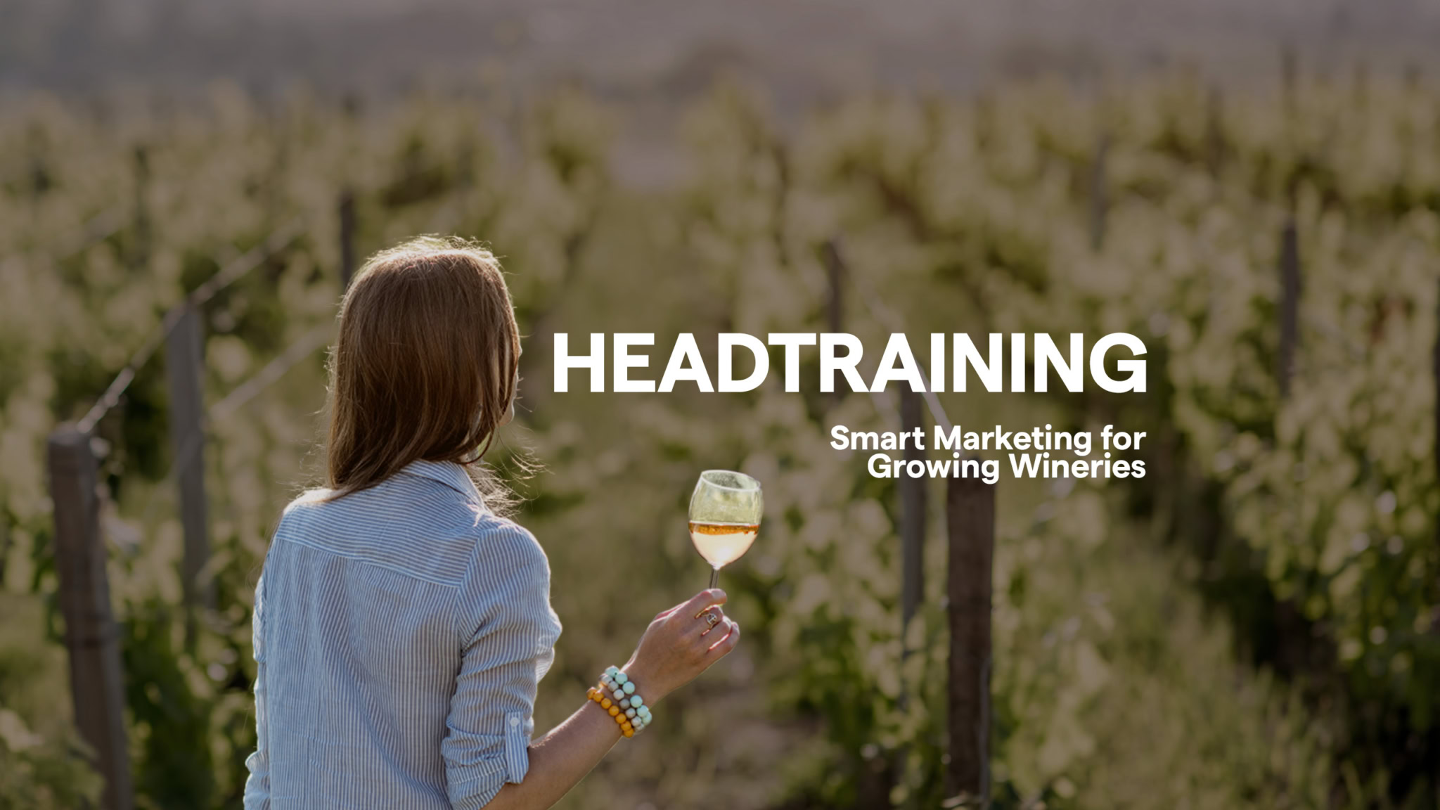 Woman in Vineyard holding wine glass with text reading Headtraining, Smart Marketing for Growing Wineries. Thumbnail for series of Free Wine Marketing Resources by 5forests.