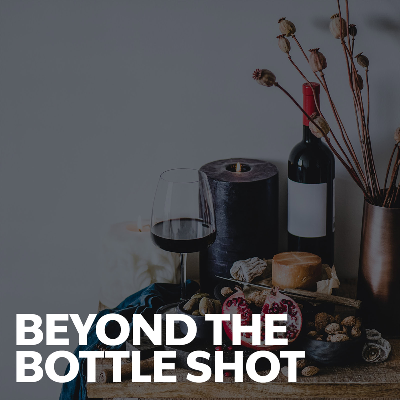 Podcast cover that reads Beyond the Bottle Shot. text atop darkened image of wine bottles and food on a table.