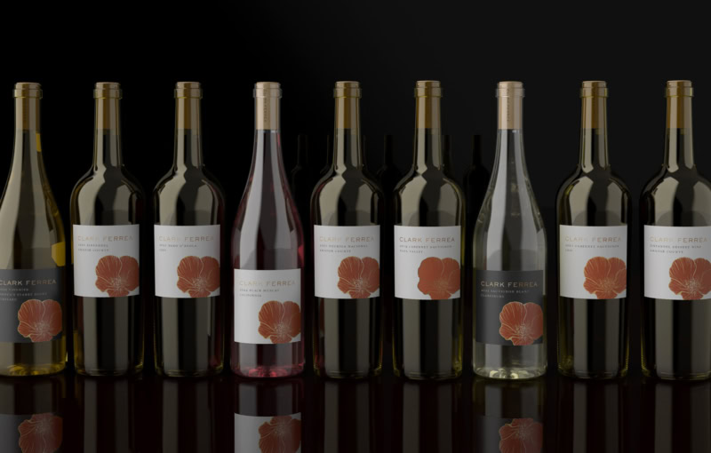 a lineup of nine bottles of Clark Ferrea Wine set before a black minimal background