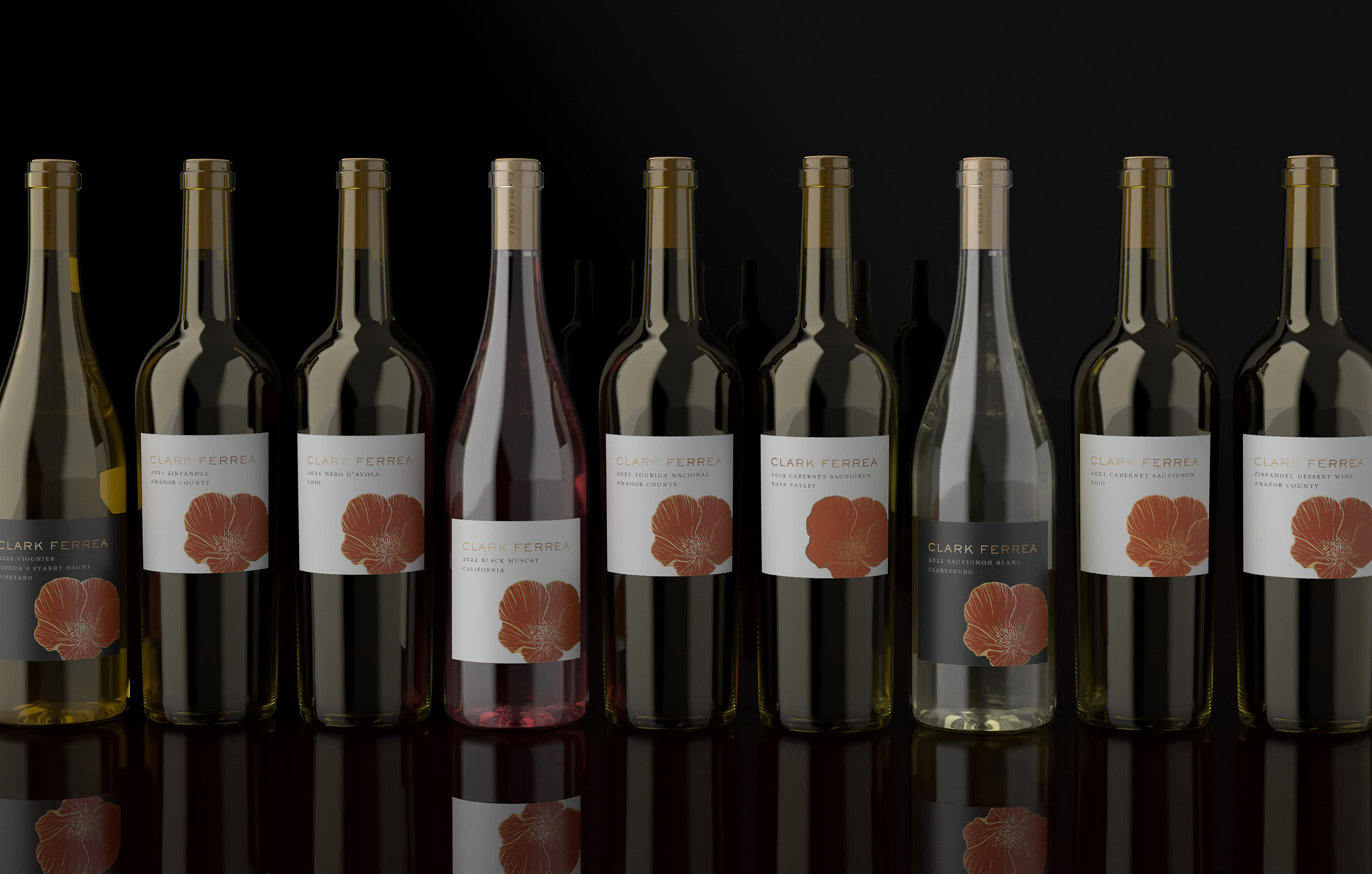 a line up of nine Clark Ferrea Wines, set atop a black table before a black background
