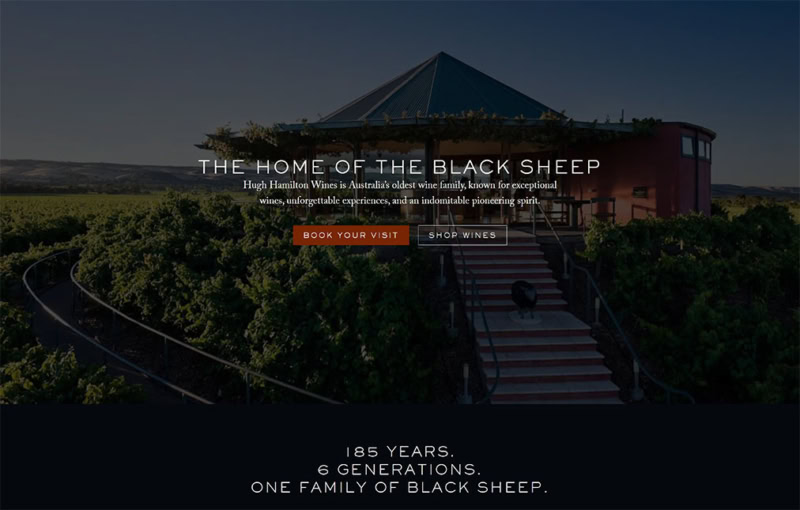 A view of Hugh Hamilton Wines' iconic circular tasting room surrounded by vineyards, overlaid with the text “The Home of the Black Sheep” and a message highlighting 185 years and six generations of winemaking in Australia.
