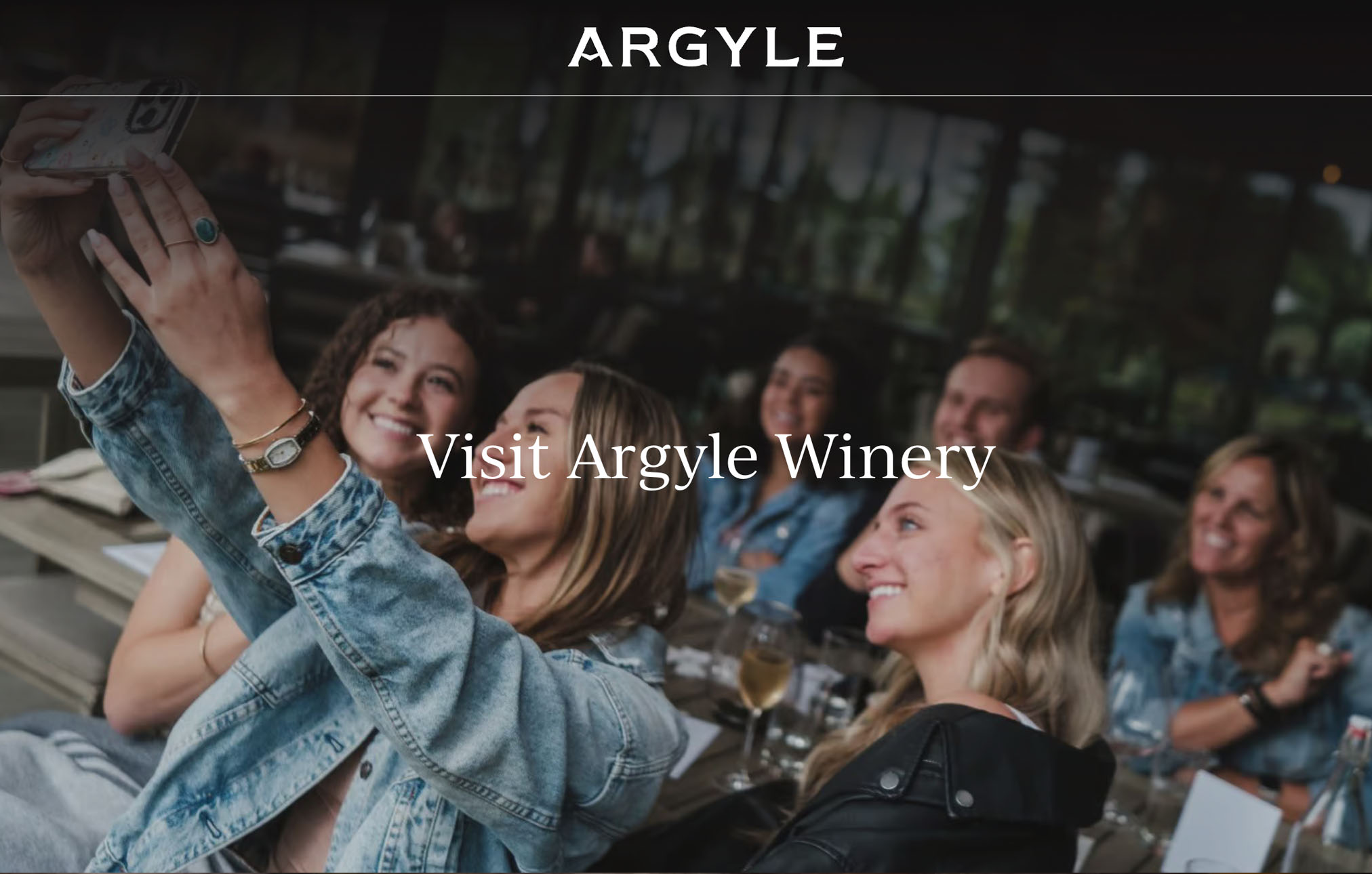 A group of women smiling and taking selfies at the Argyle Winery Tasting Room in Dundee Oregon