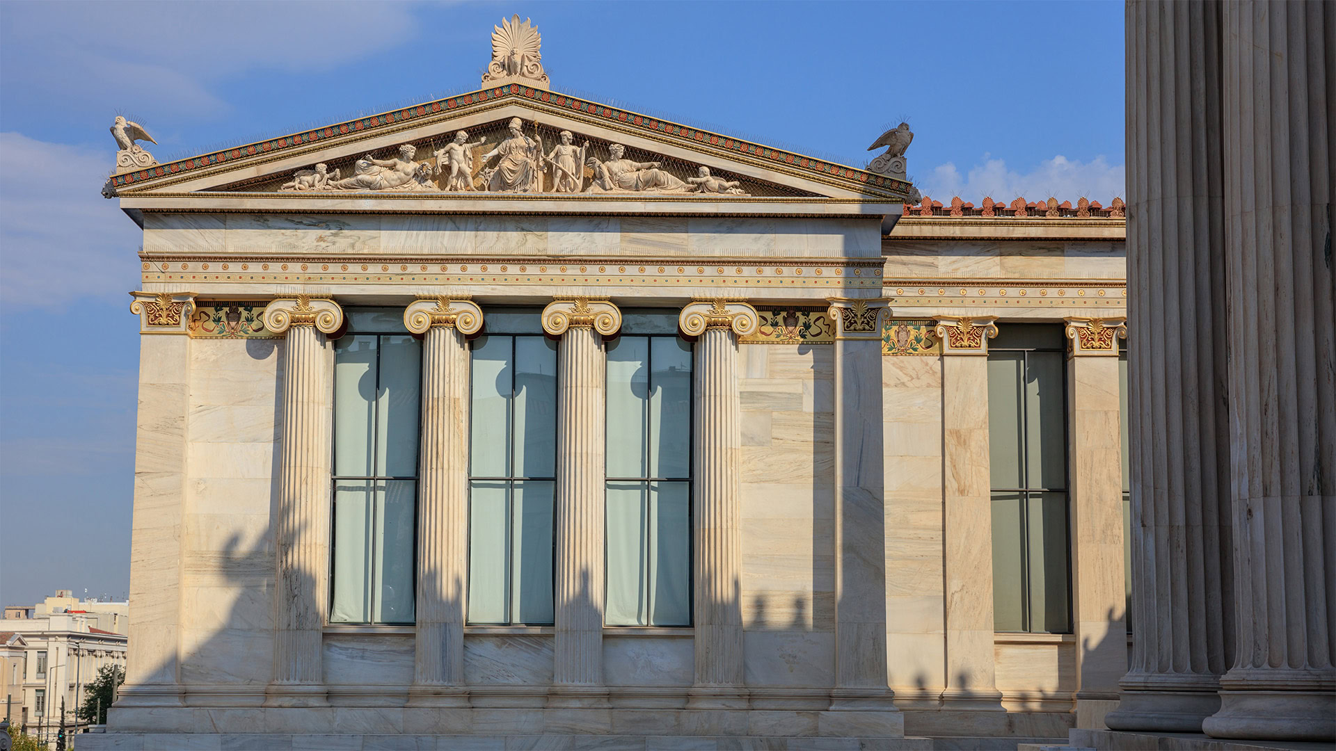 facade of the Academy of Athens featuring elements of neoclassical design.