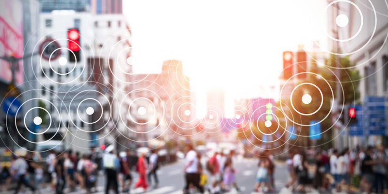 crowd walking in busy street with graphical circle overlays indicating thinking or analysis