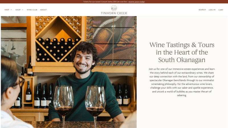 A smiling man sits at a tasting bar at Tinhorn Creek winery with two glasses of red wine in the foreground, surrounded by wine bottles and decor. Beside the image, text reads: "Wine Tastings & Tours in the Heart of the South Okanagan. Join us for one of our immersive estate experiences and learn the story behind each of our extraordinary wines..."