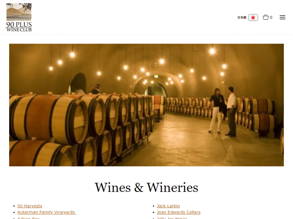 The 90 Plus Wine Club wines and wineries page in a desktop browser, with a barrel hall lit by rows of hanging lamps above the heading "Wines & Wineries" and two columns of winery links.
