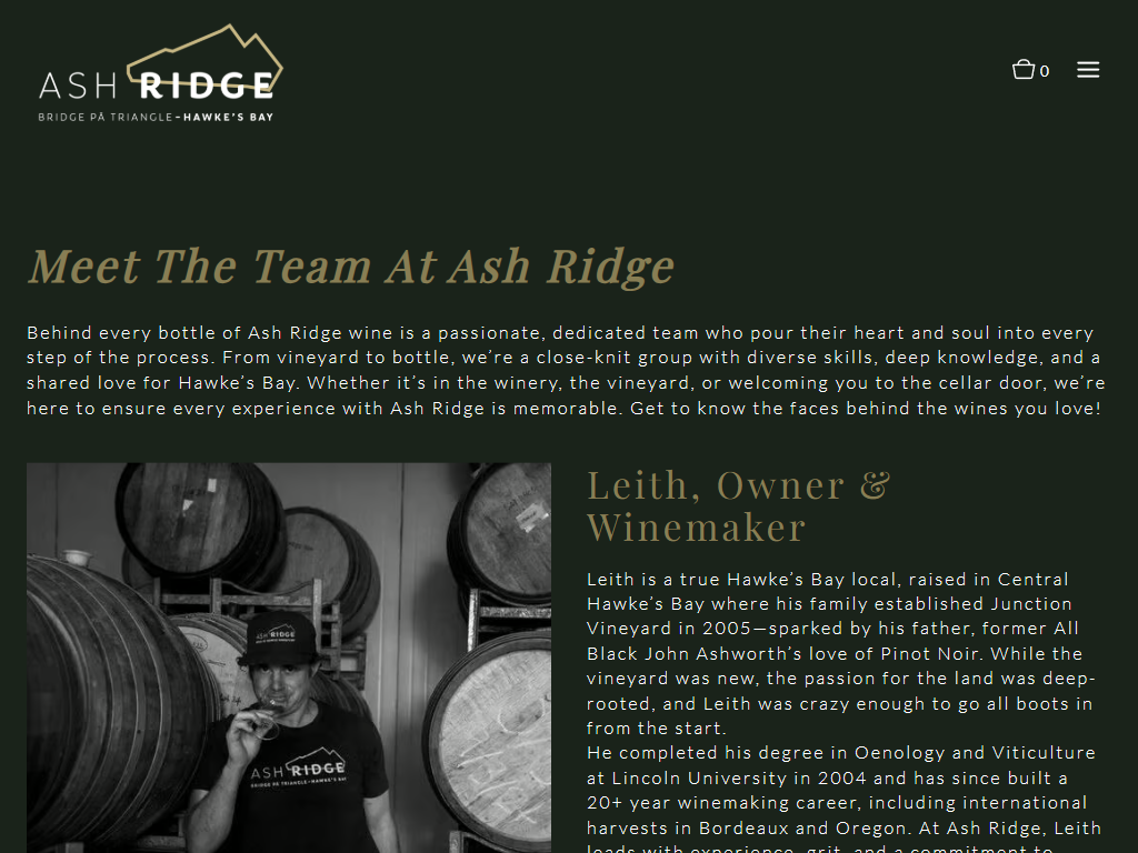 The Ash Ridge team page in a desktop browser, headed "Meet The Team At Ash Ridge", with a black and white photograph of the owner and winemaker beside the barrels.