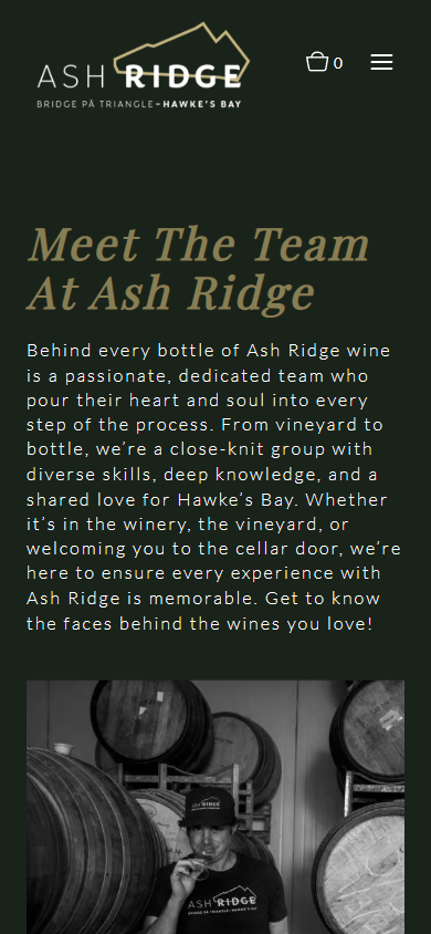 The Ash Ridge team page on a phone, headed "Meet The Team At Ash Ridge", with the black and white barrel room portrait below the introduction.