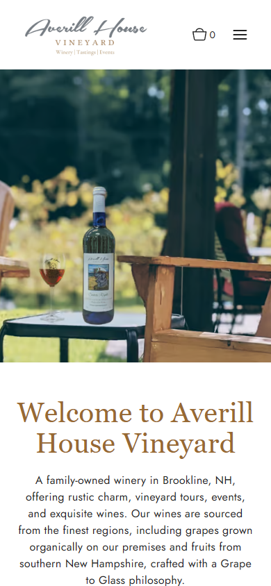 The Averill House homepage on a phone, with the bottle and glass on the table by the vines above the welcome heading.