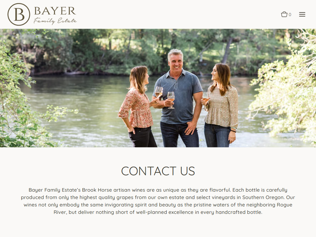 The Bayer Family Estate contact page in a desktop browser, headed "Contact Us", with three people holding wine glasses beside a river.