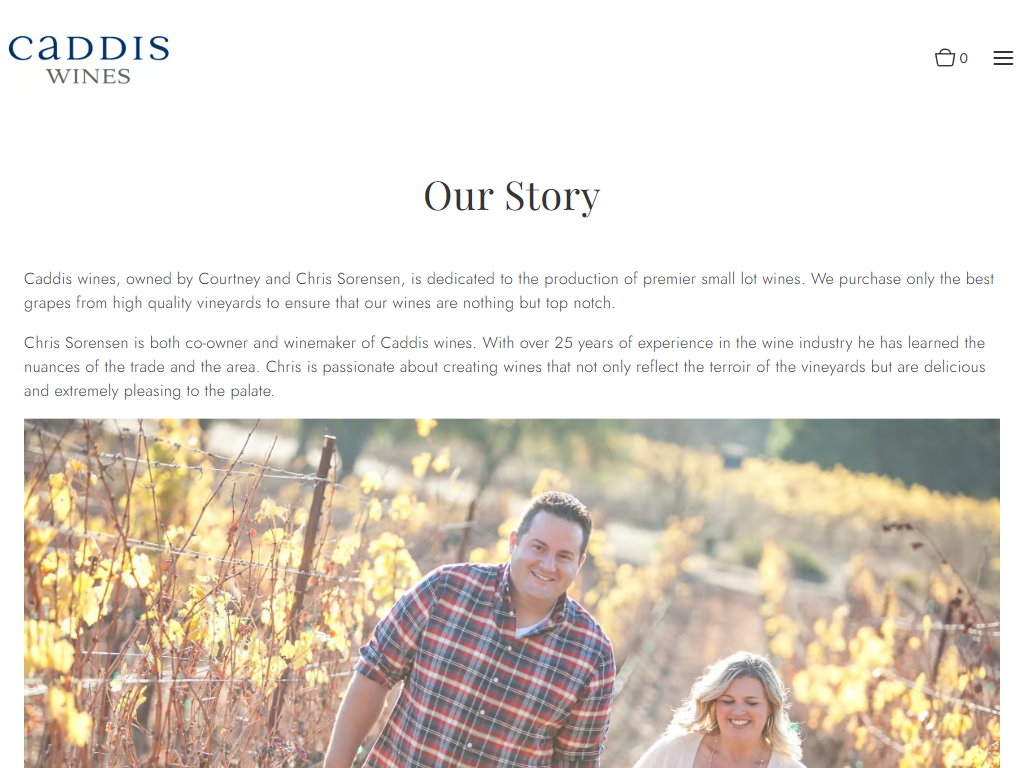The Caddis Wines About page in a desktop browser, headed "Our Story", with a photograph of the two owners among autumn vines.
