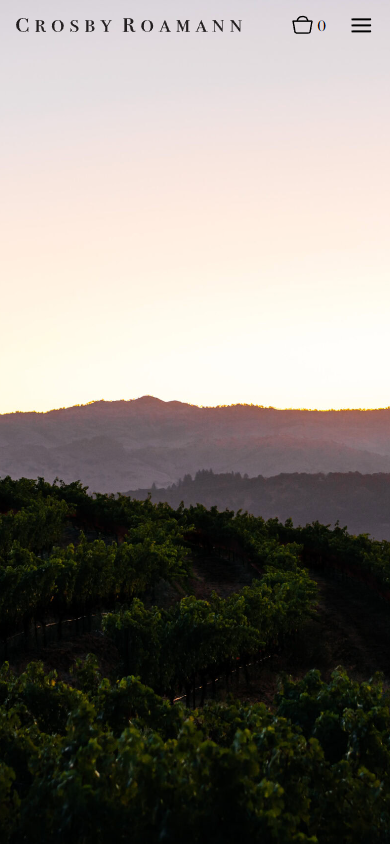 The Crosby Roamann story page on a phone, with a photograph of the ridgeline at dusk above the vineyard.