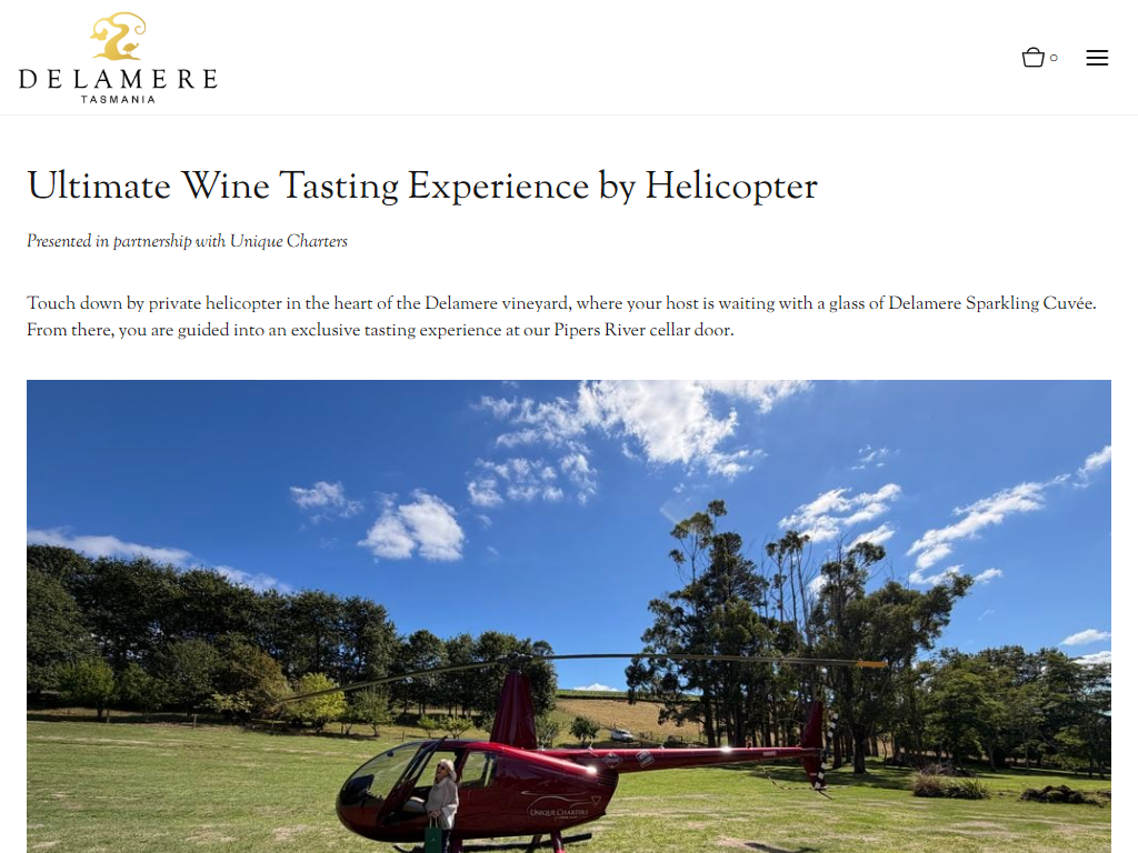 The Delamere helicopter experience page in a desktop browser, headed "Ultimate Wine Tasting Experience by Helicopter", with a red helicopter standing on the lawn at the estate.