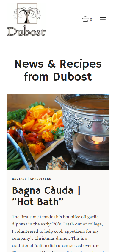 The Dubost blog on a phone, headed "News & Recipes from Dubost", with the bagna càuda post and its photograph.