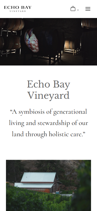 The Echo Bay homepage on a phone, with the barrel cellar photograph above the winery name and a quote about generational living and stewardship of the land through holistic care.