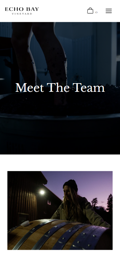 The Echo Bay team page on a phone, headed "Meet The Team", with a dark interior photograph above a night shot of the winery.