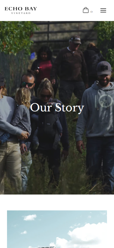 The Echo Bay story page on a phone, headed "Our Story" over the harvest group in the vine rows.