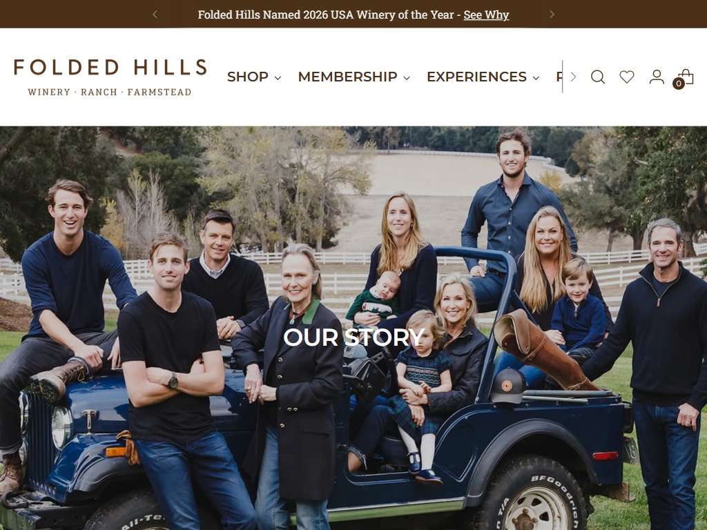The Folded Hills story page in a desktop browser, headed "Our Story", with a family group photographed around an open-topped vehicle.