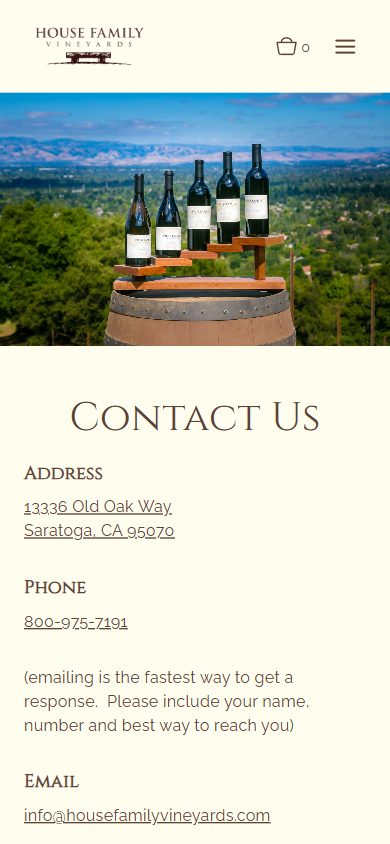 The House Family contact page on a phone, with bottles on a barrel above the heading "Contact Us" and the address, phone number and email.