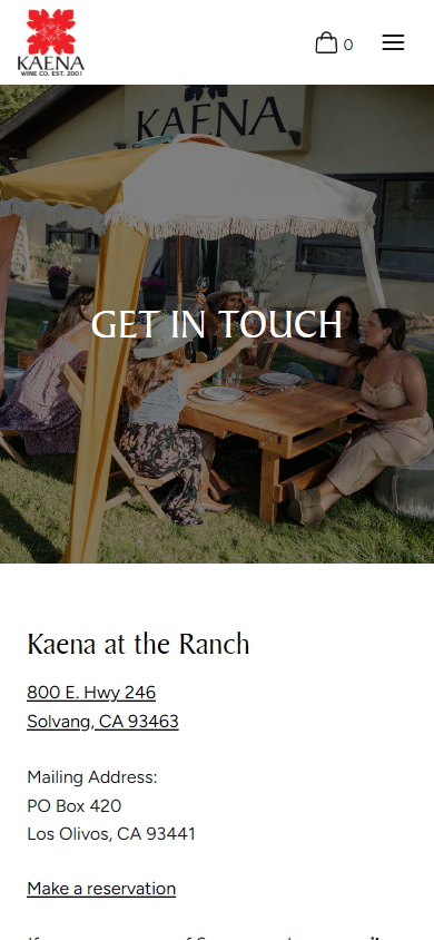 The Kaena contact page on a phone, headed "Get in Touch" over a branded umbrella and picnic table, with the ranch and mailing addresses below.
