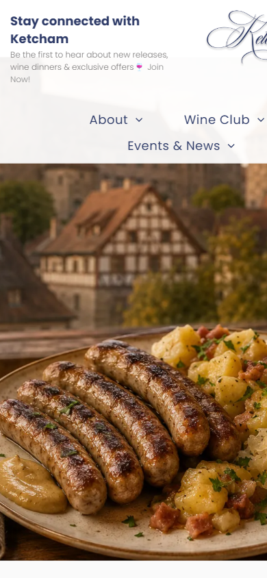 The Ketcham Estate homepage on a phone, showing the river cruise promotion with a plate of local food and a half-timbered town.