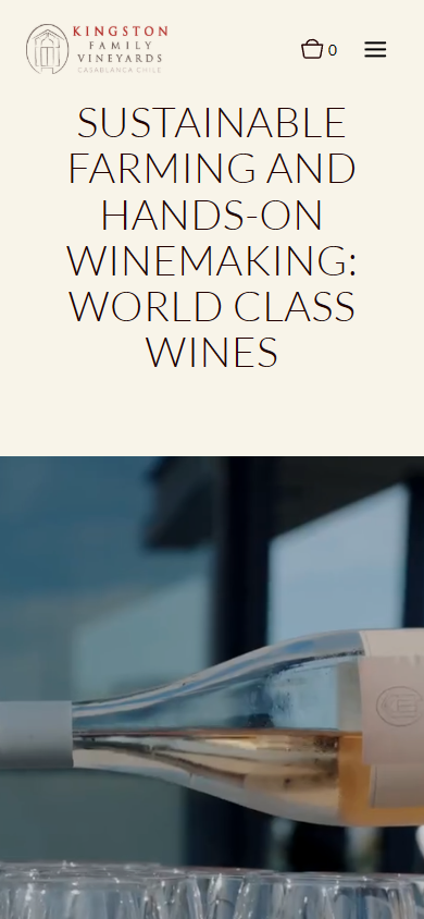 The Kingston Family Vineyards homepage on a phone, with the heading about sustainable farming and hands-on winemaking above a close photograph of wine glasses.