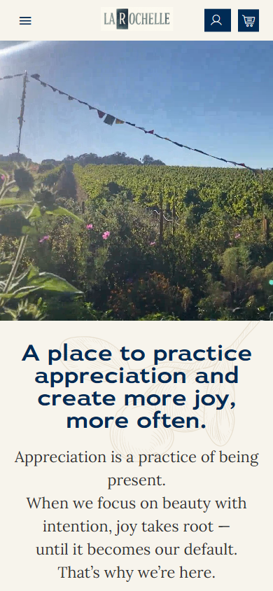 The La Rochelle homepage on a phone, with the bunting over the vineyard above the line about practicing appreciation.