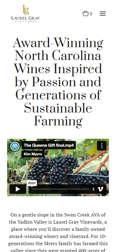 The Laurel Gray homepage on a phone, with the award-winning North Carolina wines headline above the grape harvest video.