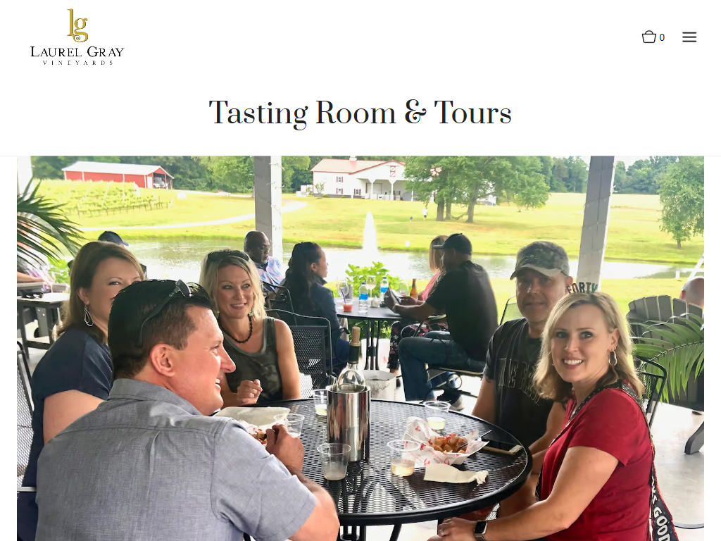 The Laurel Gray tasting room page in a desktop browser, headed "Tasting Room & Tours", with guests seated around an outdoor table beside the water.