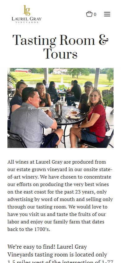 The Laurel Gray tasting room page on a phone, headed "Tasting Room & Tours", with the outdoor table photograph above the visiting details.