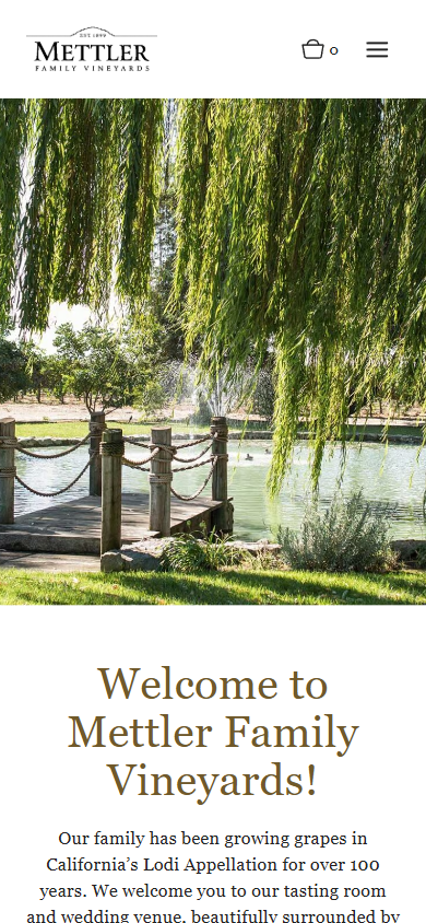 The Mettler homepage on a phone, with the willows and pond above the welcome heading.