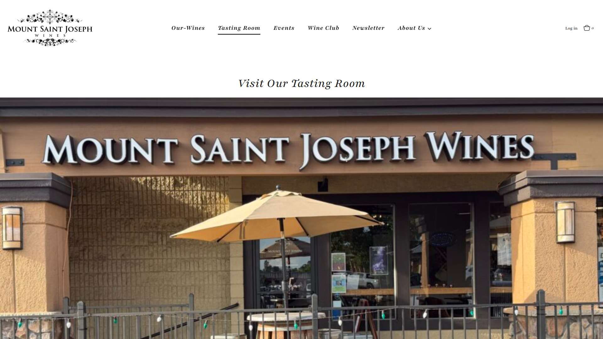 The Mount Saint Joseph tasting room page in a desktop browser, headed "Visit Our Tasting Room", with a photograph of the shopfront sign and a patio umbrella outside.