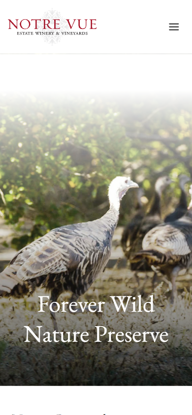 The Notre Vue nature preserve page on a phone, headed "Forever Wild Nature Preserve", with a wild turkey photographed in the long grass.
