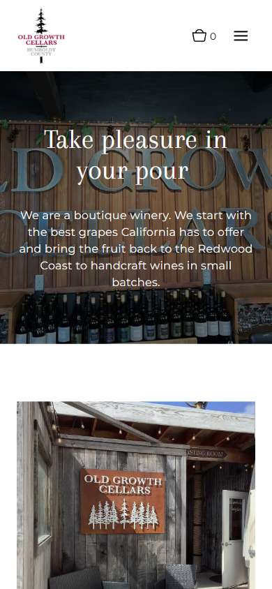 The Old Growth Cellars homepage on a phone, with "Take pleasure in your pour" over the carved sign, above a photograph of the tasting room entrance.