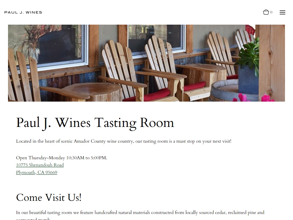 The Paul J. Wines visit page in a desktop browser, headed "Paul J. Wines Tasting Room" under a photograph of wooden chairs on the porch, with the Amador County address and the Thursday to Monday opening hours.