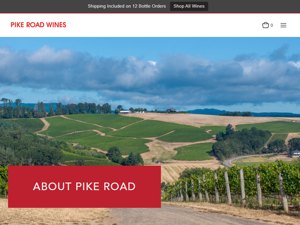 The Pike Road Wines About page in a desktop browser, with a wide view over rolling vineyard hills and a red panel reading "About Pike Road".