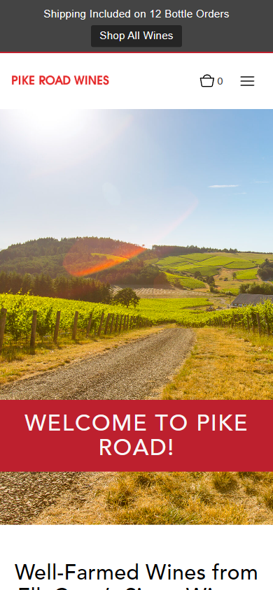 The Pike Road Wines homepage on a phone, with the vineyard track photograph and the red "Welcome to Pike Road!" panel above the introduction.
