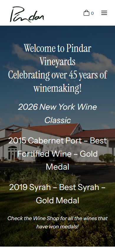 The Pindar homepage on a phone, with the welcome, the 45 years line and the gold medal results over the winery photograph.