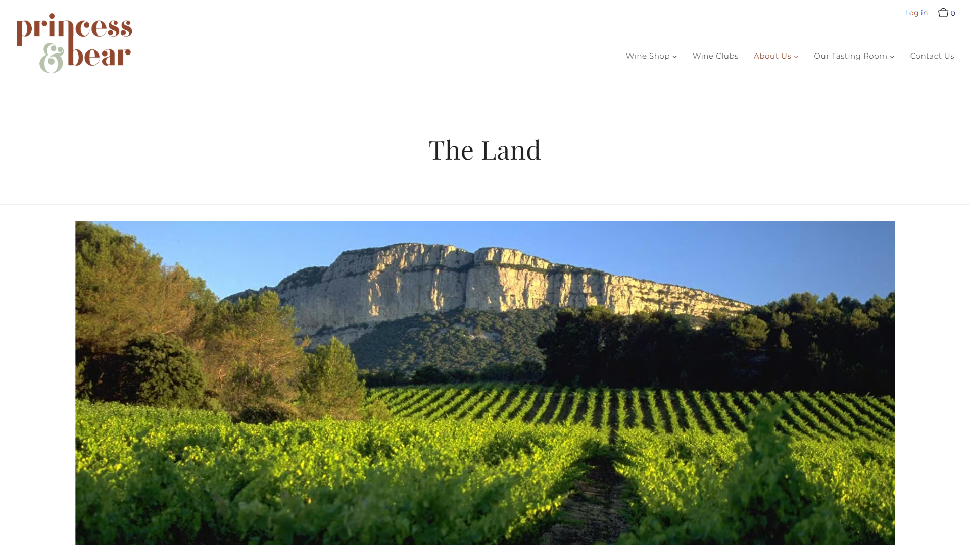 The Princess & Bear land page in a desktop browser, headed "The Land", with limestone cliffs rising behind the vine rows.