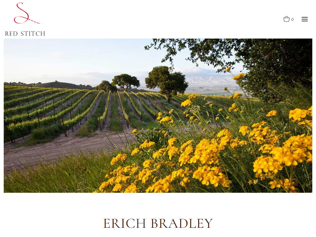 The Red Stitch winemaker page in a desktop browser, with a vineyard bordered by yellow flowering mustard above the winemaker's name.
