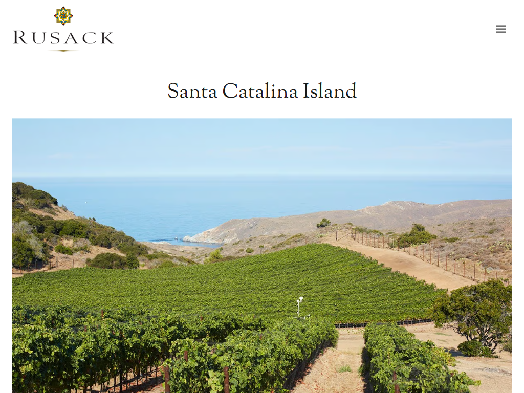 The Rusack Vineyards Santa Catalina Island page in a desktop browser, with a photograph of vineyard rows on a hillside above the sea.