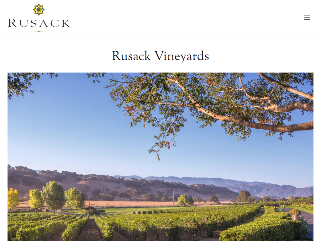 The Rusack Vineyards page in a desktop browser, headed "Rusack Vineyards", with an oak tree framing a view across the vines to the hills.