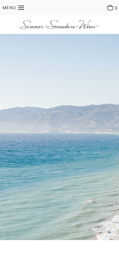 The Summer Somewhere homepage on a phone, filled by the photograph of the sea and the coastal hills.