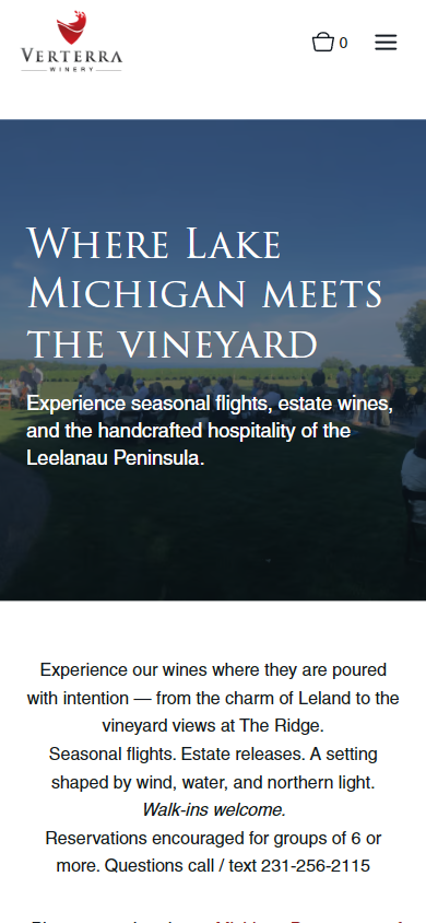 The Verterra Visit Us page on a phone, headed "Where Lake Michigan meets the vineyard", with the tasting and reservation details below.