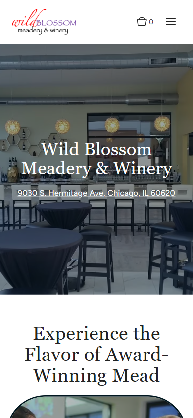 The Wild Blossom homepage on a phone, with the tasting room photograph and business name above the award-winning mead line.