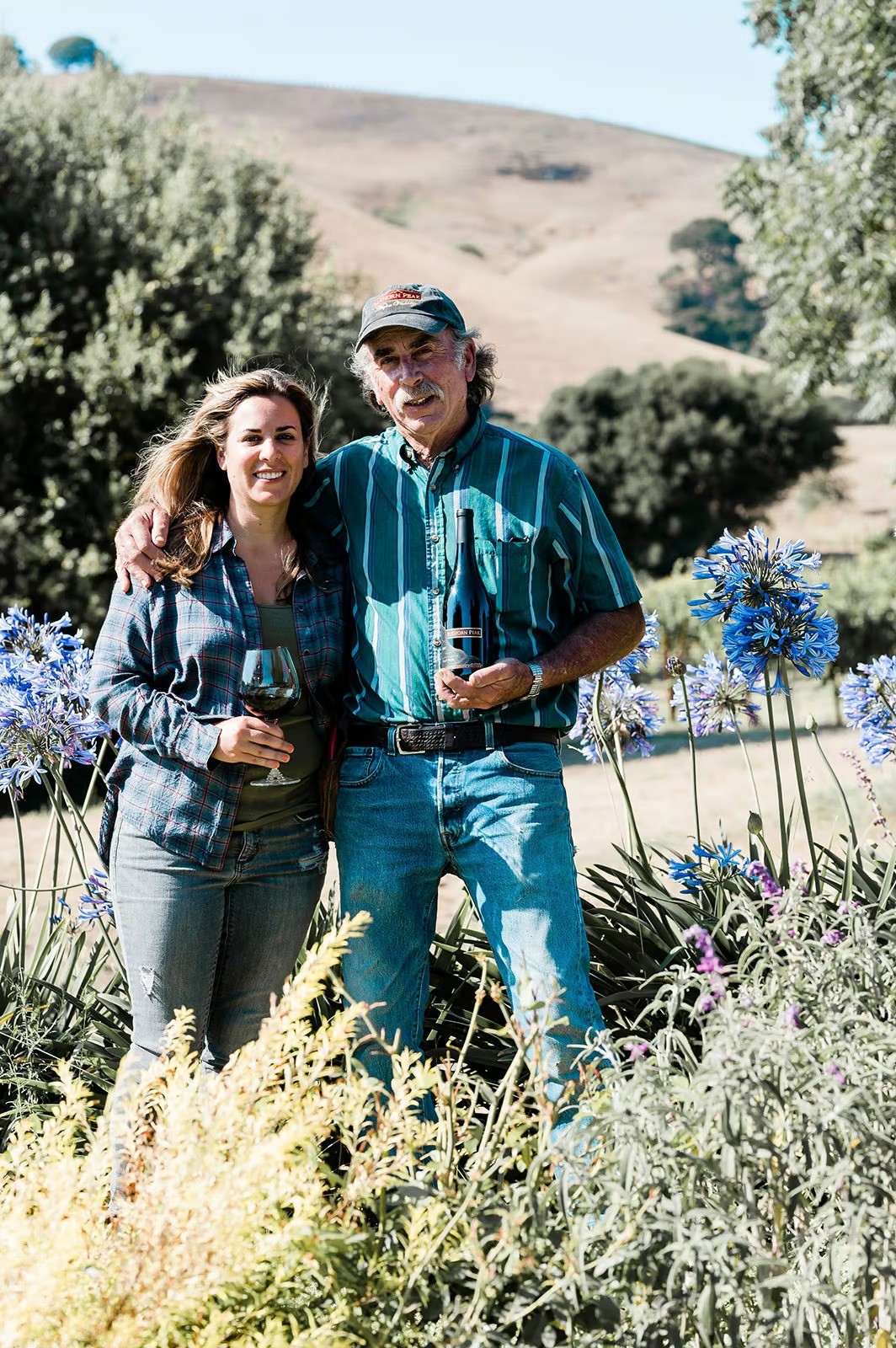 Elise and Ken Nerlove of Elkhorn Peak Cellars among the flowers at the vineyard