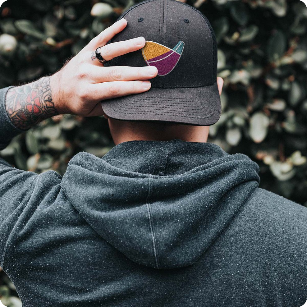 A cap concept with the embroidered VA Wine & Cider Club logomark