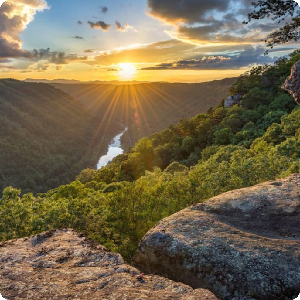 Sunset over a forested Virginia river gorge